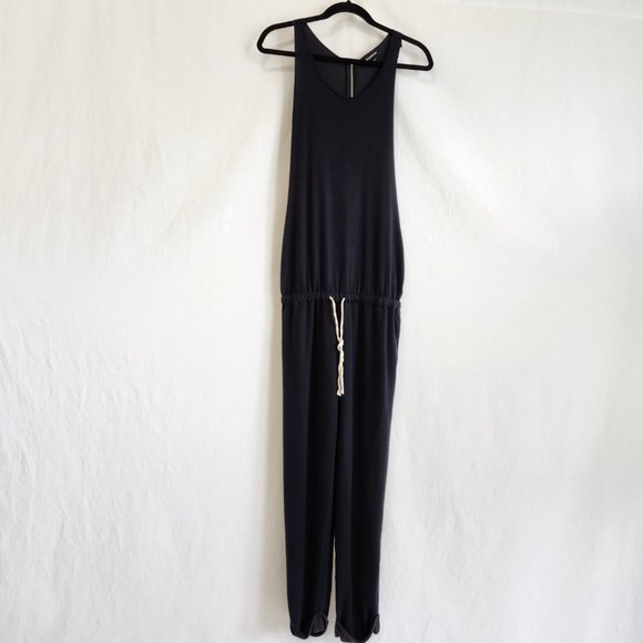 bebe Pants - BEBE Black Relaxed Fit Jumpsuit Size S 68% Super Soft and Comfortable  Exc. Cond